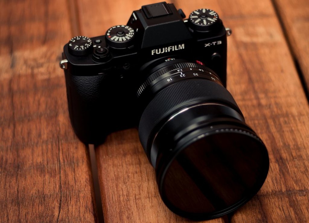 black Fujifilm brand digital camera 