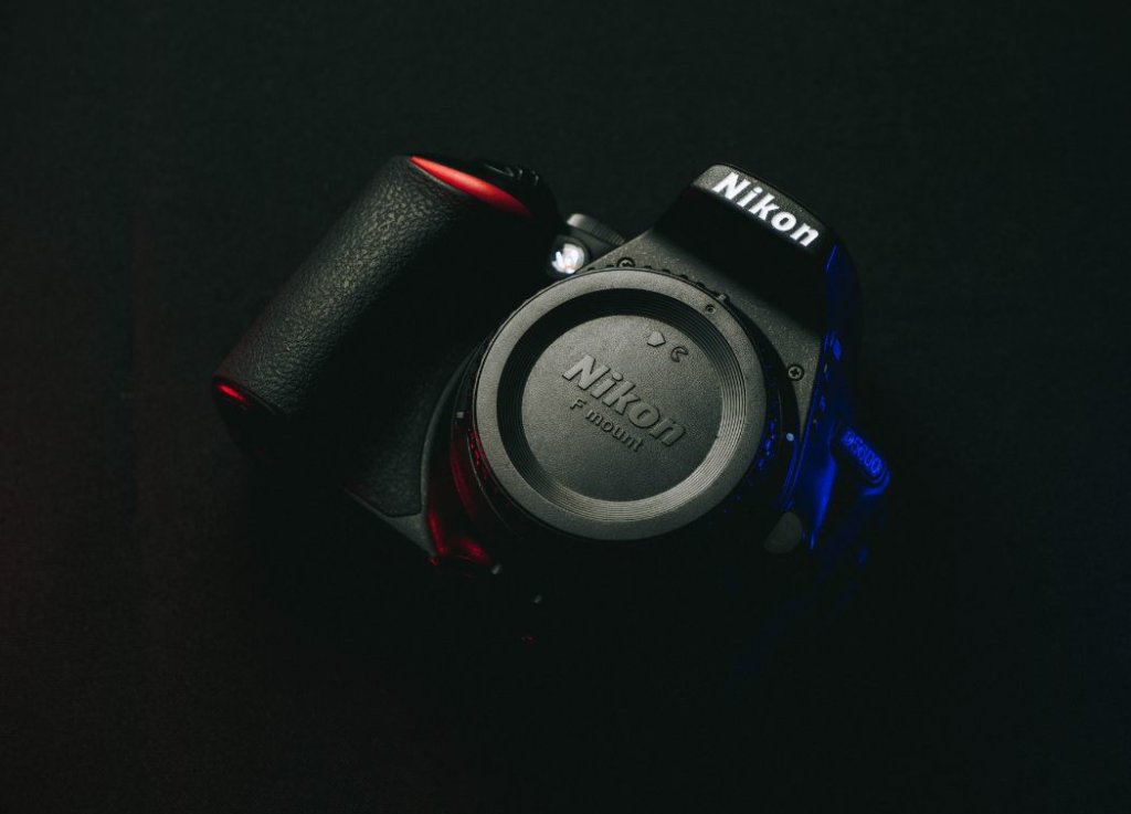 black Nikon brand digital camera 